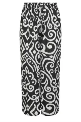 YOURS Curve Black Abstract Print Crinkle Tassel Trousers