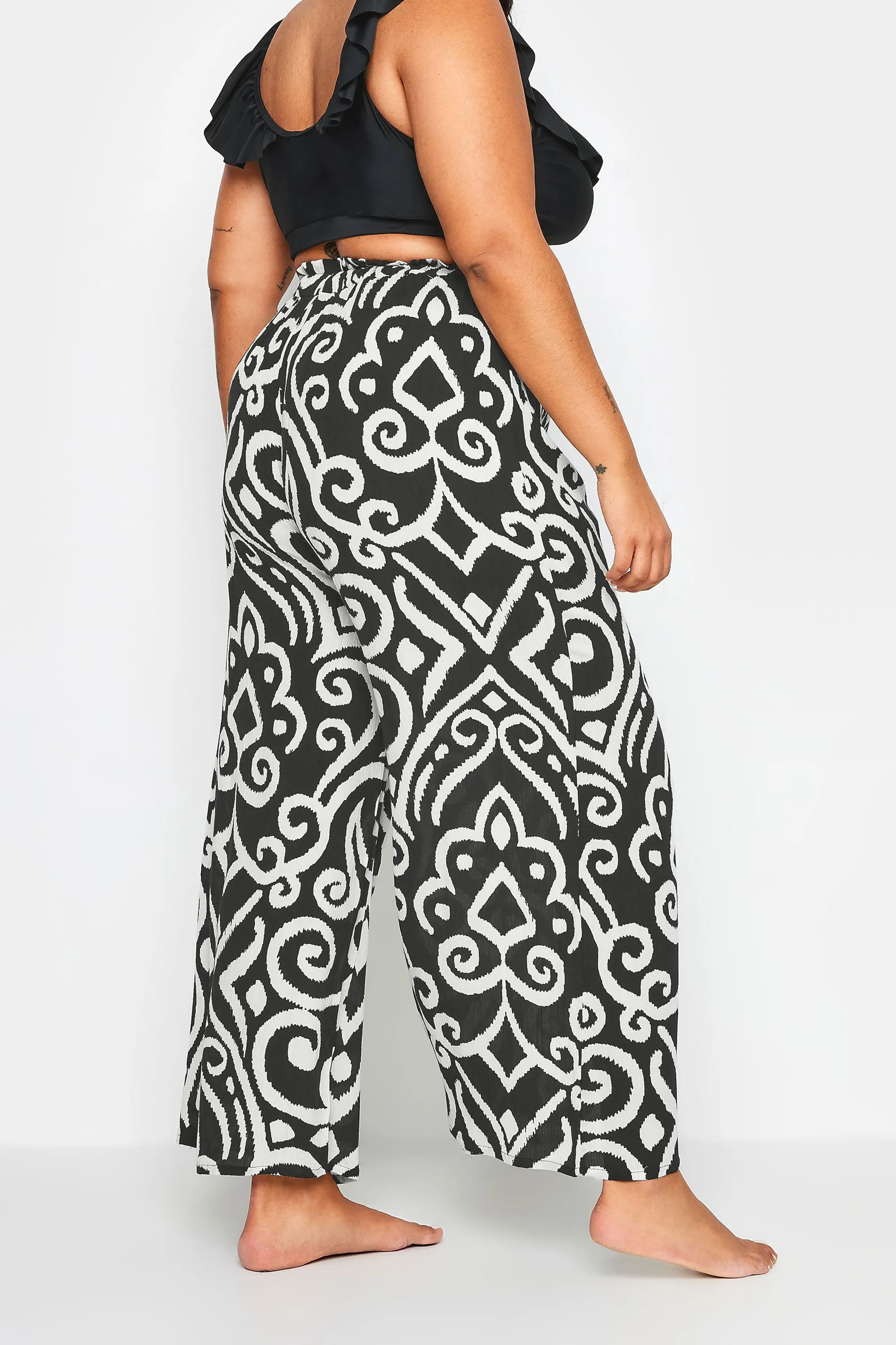 YOURS Curve Black Abstract Print Crinkle Tassel Trousers